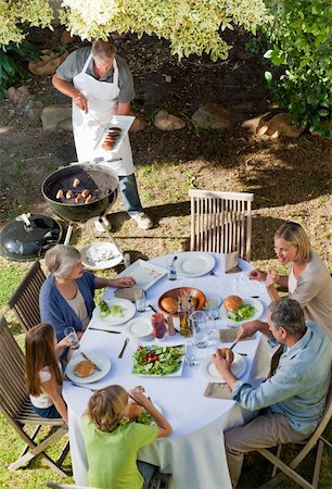 simsearch:400-04327229,k - Lovely family eating in the garden Stock Photo - Budget Royalty-Free & Subscription, Code: 400-04326358
