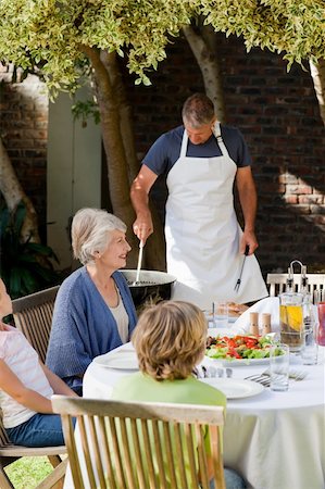 simsearch:400-04327229,k - Family eating in the garden Stock Photo - Budget Royalty-Free & Subscription, Code: 400-04326350