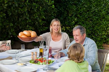 simsearch:400-04327229,k - Family eating in the garden Stock Photo - Budget Royalty-Free & Subscription, Code: 400-04326351