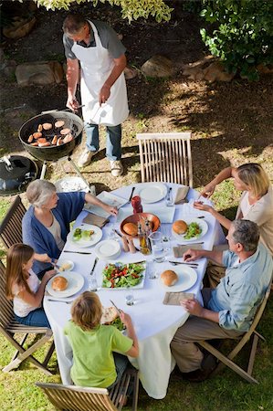 simsearch:400-04327229,k - Family eating in the garden Stock Photo - Budget Royalty-Free & Subscription, Code: 400-04326353