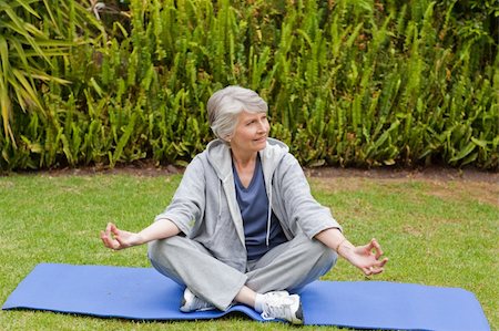 Retired woman practicing yoga in the garden Stock Photo - Budget Royalty-Free & Subscription, Code: 400-04326427