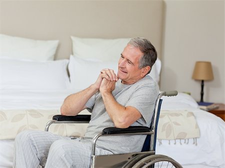 simsearch:400-04327098,k - Smiling senior man in his wheelchair  at home Stock Photo - Budget Royalty-Free & Subscription, Code: 400-04326638