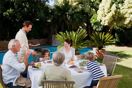 simsearch:400-04327229,k - Family eating in the garden Stock Photo - Budget Royalty-Free & Subscription, Code: 400-04326780