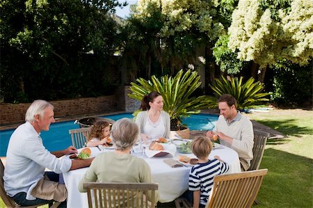 simsearch:400-04327229,k - Family eating in the garden Stock Photo - Budget Royalty-Free & Subscription, Code: 400-04326781