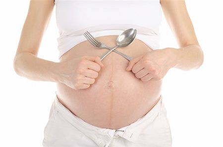 stomachs of pregnant women with a spoon and fork isolated on white Stock Photo - Budget Royalty-Free & Subscription, Code: 400-04326844