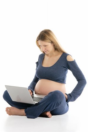 pregnant woman with a laptop sitting on the floor isolated on white Stock Photo - Budget Royalty-Free & Subscription, Code: 400-04326998