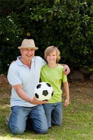 Grandfather and his grandson looking at the camera Stock Photo - Budget Royalty-Free & Subscription, Code: 400-04327128