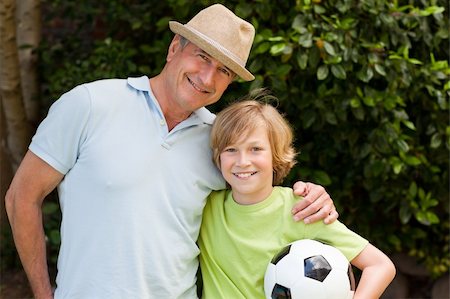 Grandfather and his grandson looking at the camera Stock Photo - Budget Royalty-Free & Subscription, Code: 400-04327131