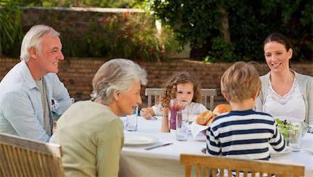 simsearch:400-04327229,k - Family eating in the garden Stock Photo - Budget Royalty-Free & Subscription, Code: 400-04327227