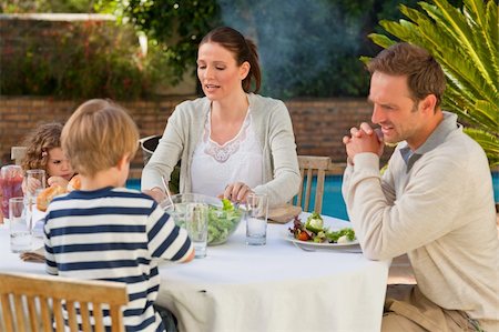 simsearch:400-04327229,k - Family eating in the garden Stock Photo - Budget Royalty-Free & Subscription, Code: 400-04327229