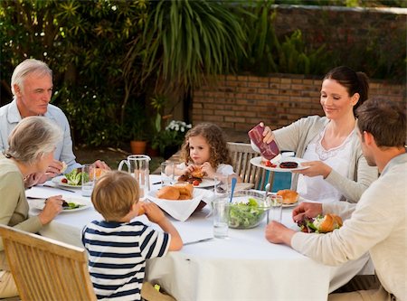 family cheese - Adorable family eating in the garden Stock Photo - Budget Royalty-Free & Subscription, Code: 400-04327235