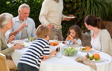 family cheese - Adorable family eating in the garden Stock Photo - Budget Royalty-Free & Subscription, Code: 400-04327233