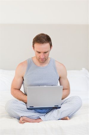 Man working on his laptop at home Stock Photo - Budget Royalty-Free & Subscription, Code: 400-04327403