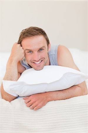 Man lying down on his bed Stock Photo - Budget Royalty-Free & Subscription, Code: 400-04327415