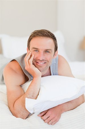 Man lying down on his bed Stock Photo - Budget Royalty-Free & Subscription, Code: 400-04327416