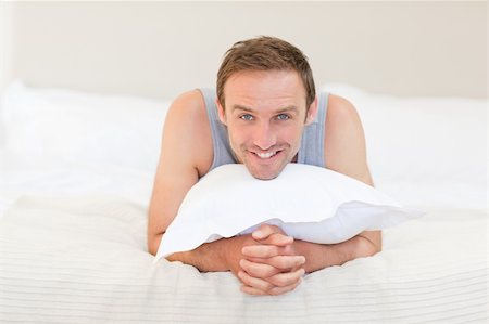 Man lying down on his bed Stock Photo - Budget Royalty-Free & Subscription, Code: 400-04327413