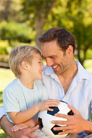 Father with his son after a football game Stock Photo - Budget Royalty-Free & Subscription, Code: 400-04327485