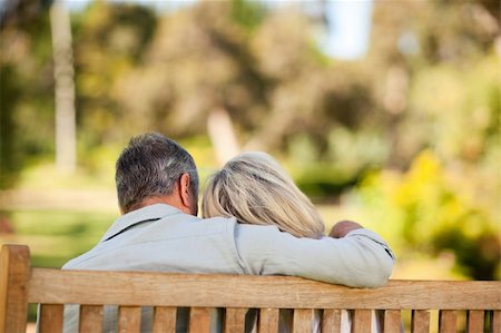 Elderly couple sitting on the bench with their back to the camera Stock Photo - Budget Royalty-Free & Subscription, Code: 400-04327714