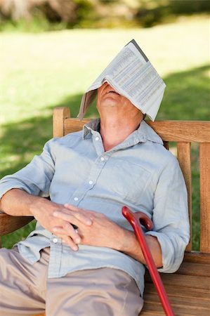 relaxing in the garden with a newspaper - Senior man sleeping on the bench Stock Photo - Budget Royalty-Free & Subscription, Code: 400-04327717