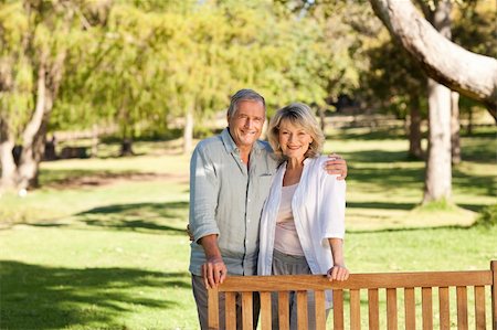 Portrait of a lovely couple behind the bench Stock Photo - Budget Royalty-Free & Subscription, Code: 400-04327749