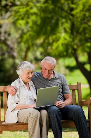 Elderly couple looking at their laptop Stock Photo - Budget Royalty-Free & Subscription, Code: 400-04327766