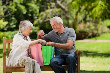 Retired couple with shopping bags Stock Photo - Budget Royalty-Free & Subscription, Code: 400-04327779