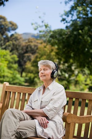 Elderly woman listening to some music Stock Photo - Budget Royalty-Free & Subscription, Code: 400-04327791