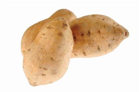 peruvian cooking - Sweet potatoes (lat. Ipomoea batatas) isolated on white (Selective Focus, Focus on the front sweet potato) Photographie de stock - Aubaine LD & Abonnement, Code: 400-04327985