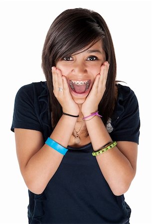 Young latina girl surprised and hands on chin with big smile on white background Stock Photo - Budget Royalty-Free & Subscription, Code: 400-04328006