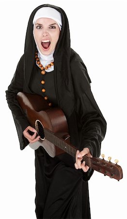 simsearch:400-05315102,k - Ethustiatic Nun singing out loud while playing a guitar Photographie de stock - Aubaine LD & Abonnement, Code: 400-04328035