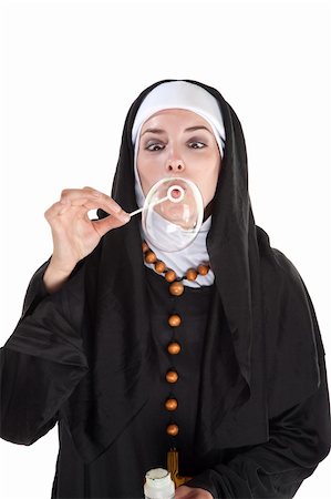 Nun blowing out a huge bubble through a plastic wand Foto de stock - Super Valor sin royalties y Suscripción, Código: 400-04328036