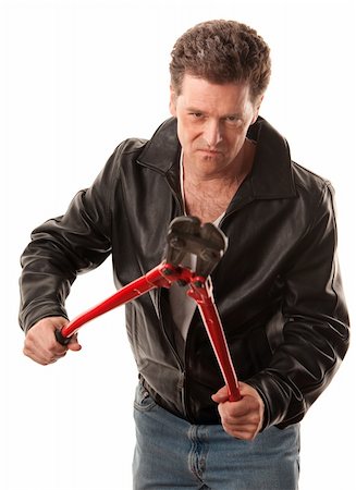 drahtschere - Tough criminal in leather jacket with heavy-duty cutters Stockbilder - Microstock & Abonnement, Bildnummer: 400-04328061