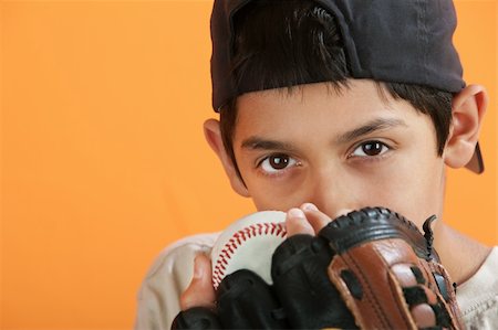 Young Hispanic male with baseball, mitt and backwards hat Stock Photo - Budget Royalty-Free & Subscription, Code: 400-04328161