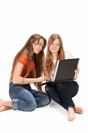 two young happy student girl work on laptop computer isolated on white Stock Photo - Budget Royalty-Free & Subscription, Code: 400-04328215