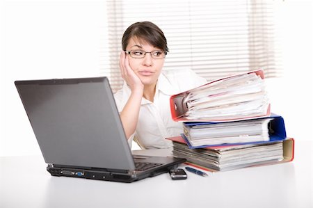 simsearch:400-08554629,k - young adult over-worked woman at desk Fotografie stock - Microstock e Abbonamento, Codice: 400-04328301