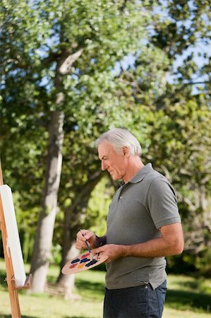 Mature man painting in the garden Stock Photo - Budget Royalty-Free & Subscription, Code: 400-04328311