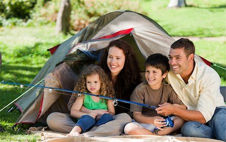 father son camping woods - Joyful family fishing Stock Photo - Budget Royalty-Free & Subscription, Code: 400-04328347