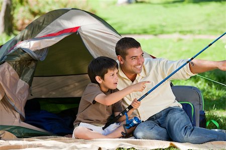 father son camping woods - Son fishing with his father Stock Photo - Budget Royalty-Free & Subscription, Code: 400-04328352