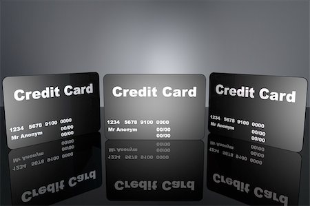 simsearch:400-04994290,k - Black credit cards on black floor with light background Fotografie stock - Microstock e Abbonamento, Codice: 400-04328561