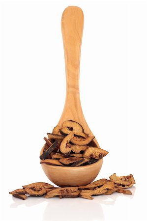 dry cured - Dried bitter orange fruit in an olive wood ladle and loose, isolated over white background. Used in chinese herbal medicine. Zhi ke. Fructus citri aurantii. Focus on the fruit. Stock Photo - Budget Royalty-Free & Subscription, Code: 400-04328813