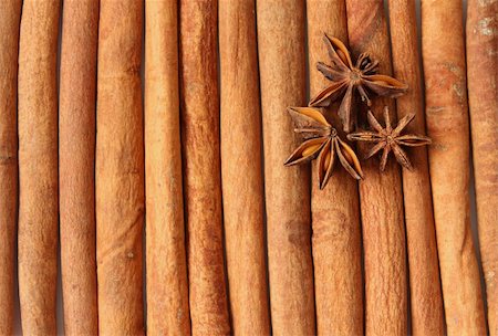 three true star anises laying on cinnamon quills. Close-up Stock Photo - Budget Royalty-Free & Subscription, Code: 400-04329574