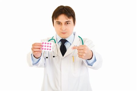 simsearch:400-07099832,k - Serious medical doctor pointing finger at pack of pills isolated on white Stock Photo - Budget Royalty-Free & Subscription, Code: 400-04329650