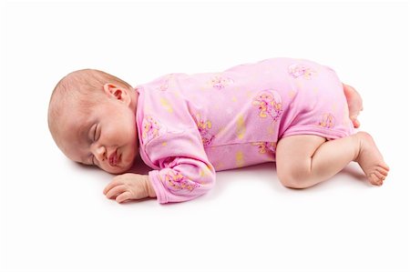 simsearch:400-04140663,k - The sleeping newborn baby girl in pink isolated on a white background Photographie de stock - Aubaine LD & Abonnement, Code: 400-04329761