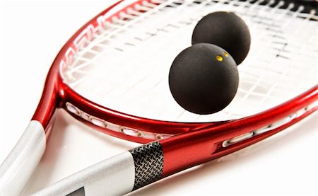 simsearch:400-04329882,k - Close up of a red and silver squash racket and ball on a white background with space for text Stock Photo - Budget Royalty-Free & Subscription, Code: 400-04329883
