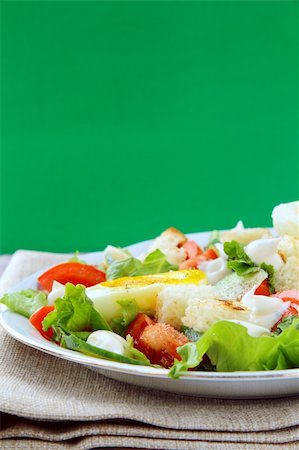 diet calories - salad with fresh vegetables, tomatoes and eggs on a plate Stock Photo - Budget Royalty-Free & Subscription, Code: 400-04320592