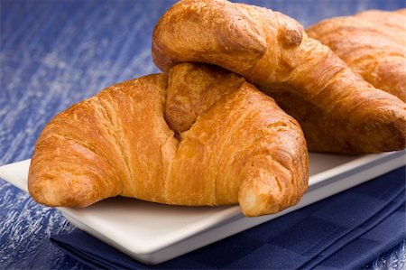 sweet and salty - photo of delicious fresh croissants for breakfast on a soft blue background Stock Photo - Budget Royalty-Free & Subscription, Code: 400-04320614