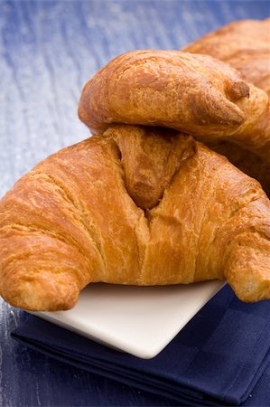 sweet and salty - photo of delicious fresh croissants for breakfast on a soft blue background Stock Photo - Budget Royalty-Free & Subscription, Code: 400-04320613