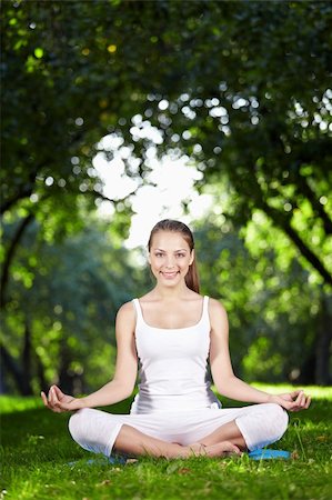 A beautiful young girl in lotus pose in the park Stock Photo - Budget Royalty-Free & Subscription, Code: 400-04320848