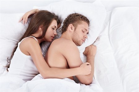 romantic pictures of lovers sleeping - Young couple embracing in bed asleep Stock Photo - Budget Royalty-Free & Subscription, Code: 400-04321152