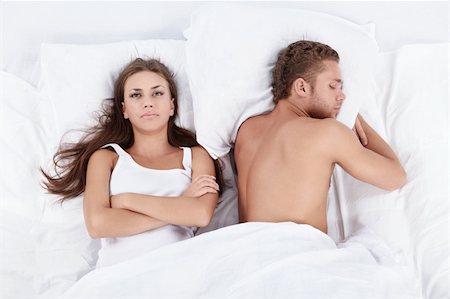 romantic pictures of lovers sleeping - Dissatisfied with the girl next to a sleeping man Stock Photo - Budget Royalty-Free & Subscription, Code: 400-04321153